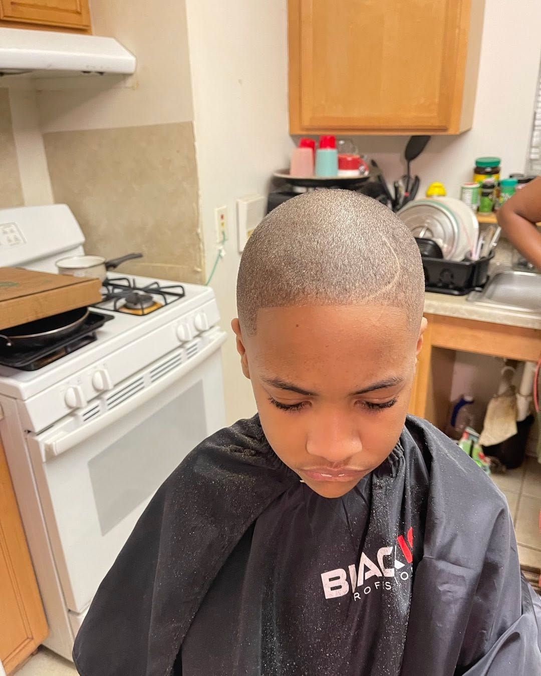 Kids even buzz cut with a crisp front line-up